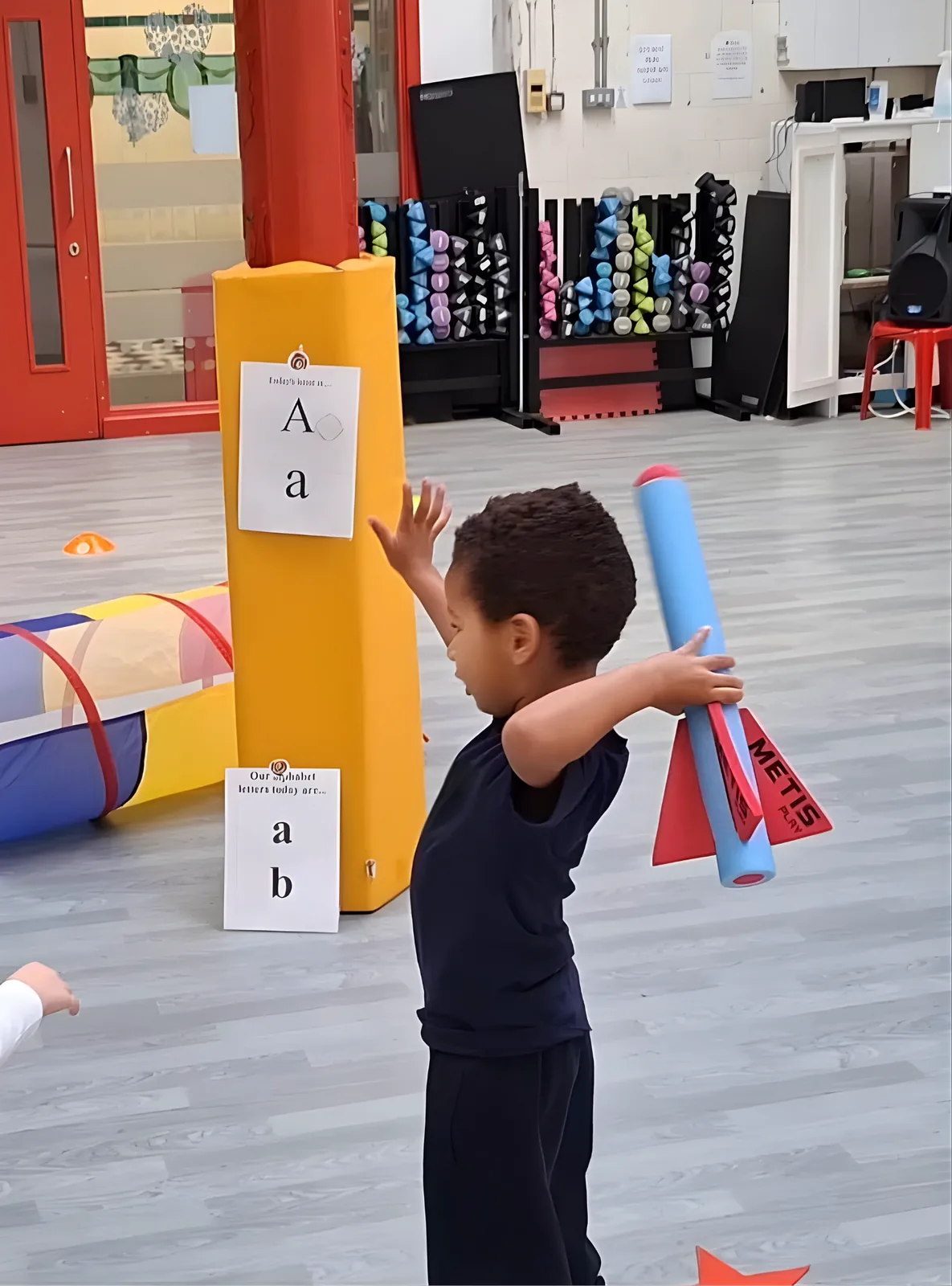A Track Totter throwing towards a letter card during Sports Phonics®